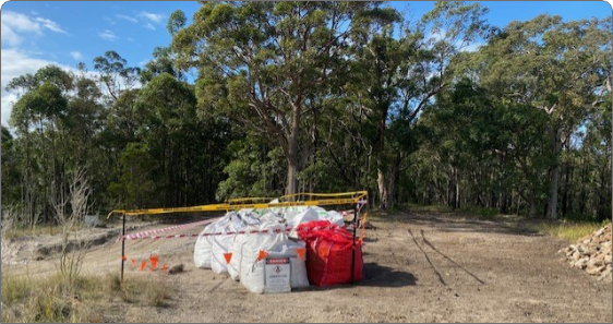 Danger area surrounded by yellow hazard strips surrounded by nature