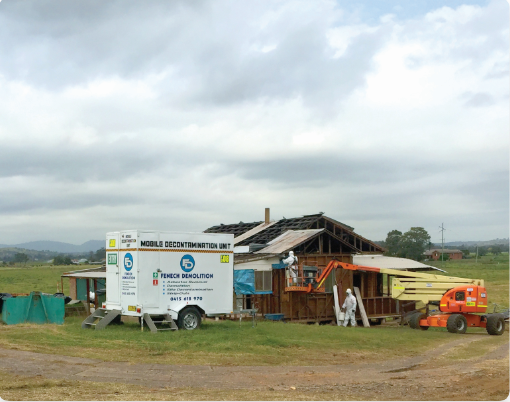 Fenech Demolition mobile decontamination unit outside of a construction site